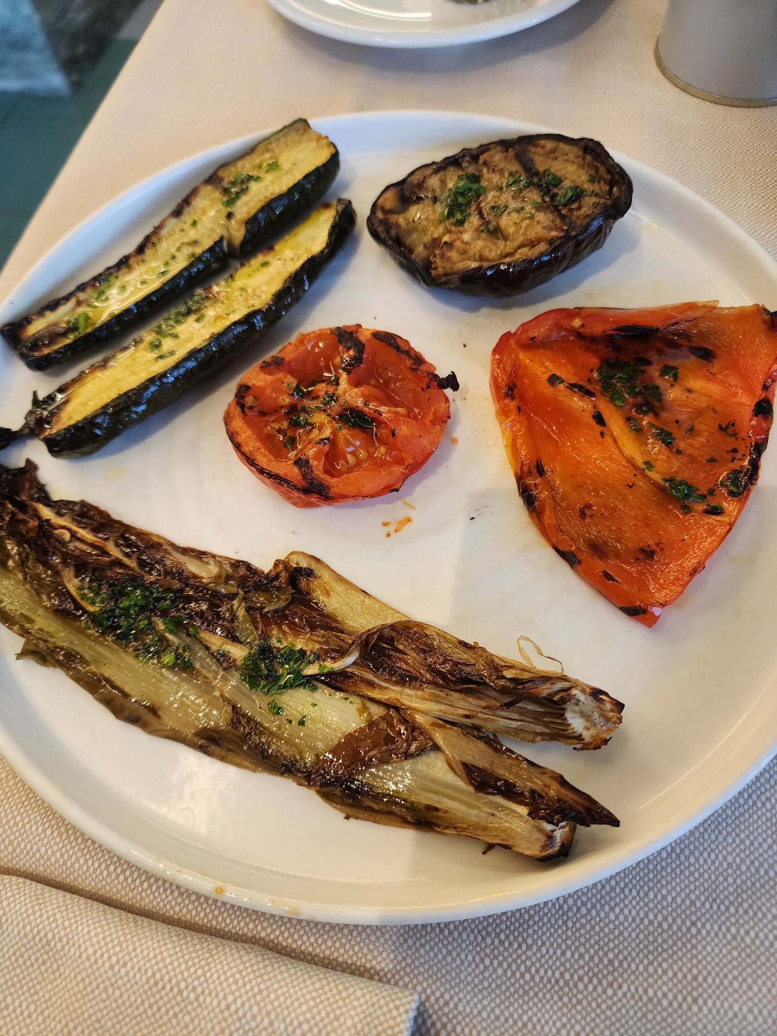 Grilled zucchini, eggplant, tomato, red pepper, and endive finished with herbs