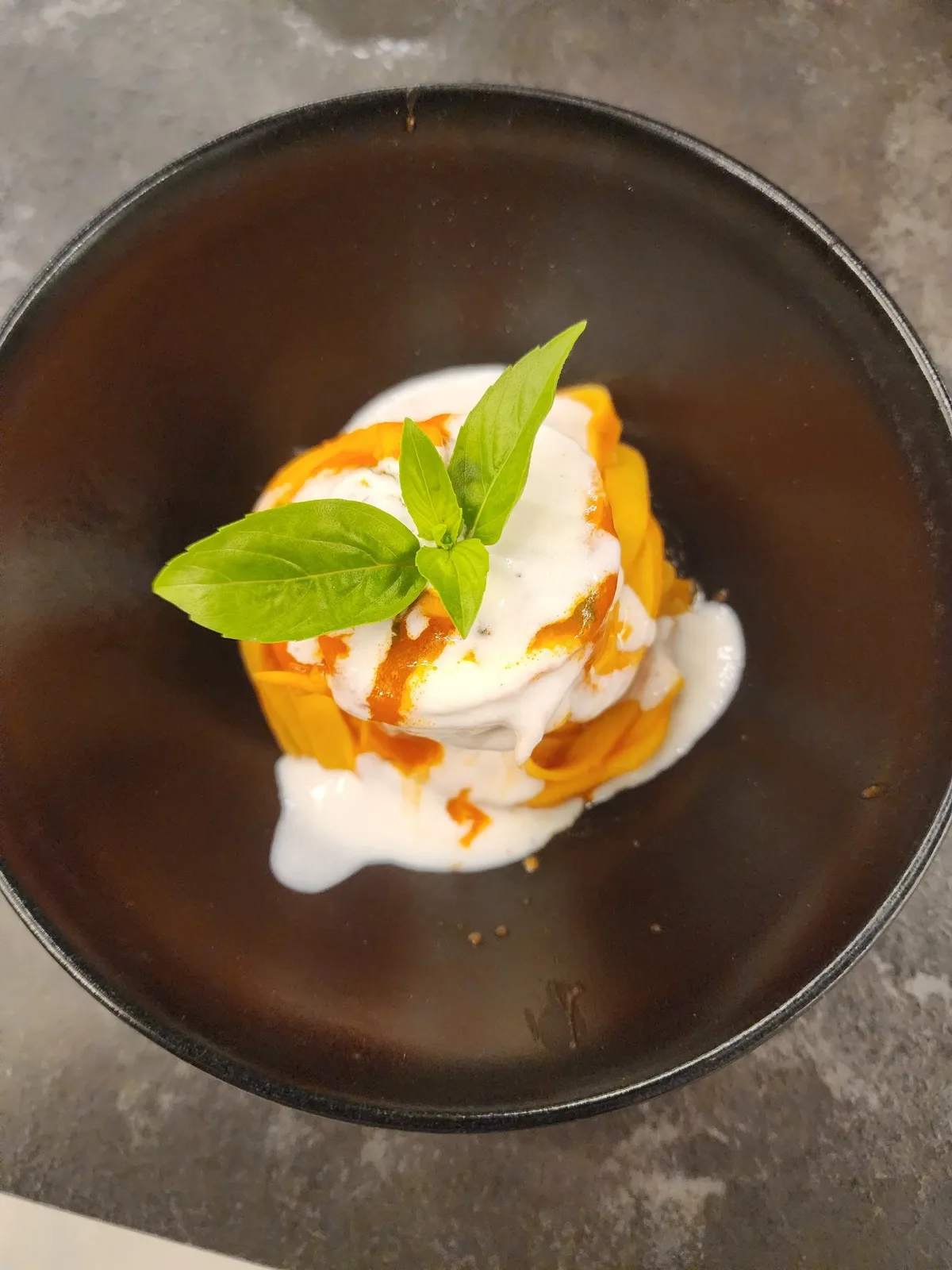 Handmade pasta nest plated with cream sauce